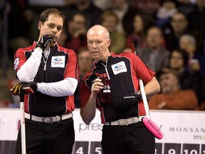 Ontario skip Glenn Howard (right) and third Richard Hart weigh their options during their semifinal match at last year's Brier in London. (QMI AGENCY)