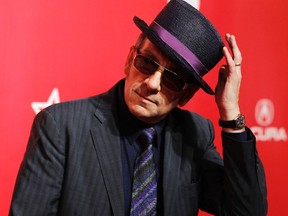 Musician Elvis Costello poses at the 2012 MusiCares Person of the Year tribute honoring Paul McCartney in Los Angeles February 10, 2012. REUTERS/Danny Moloshok