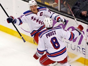 Rangers captain Ryan Callahan (left) earned a hat trick against the Flyers in Philadelphia on Saturday, Feb. 11, 2012. (REUTERS/Jessica Rinaldi)