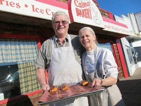 Doug and Marlene Campbell of the Calmar Bakery show off the famous Long Johns. (SUPPLIED PHOTO)