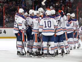 Tthe Edmonton Oilers celebrate their over-time win against the Ottawa Senators at Scotiabank Place Saturday.