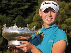Jessica Korda poses with the Women's Australian Open trophy following her victory in Melbourne on Sunday, Feb. 12, 2012. (Paul Crock/AFP)
