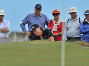 Lori Kane chips out of a bunker during the final round of the Women's Australian Open in Melbourne on Sunday. (AFP).