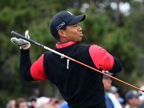 Tiger Woods drops his driver while teeing off on the 10th hole during the final round of the Pebble Beach National Pro-Am in Pebble Beach, Calif., Feb. 12, 2012. (ROBERT GALBRAITH/Reuters)