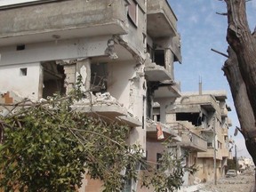 Damaged houses are seen in Bab Amro, in the city of Homs, February 13, 2012.  REUTERS/Handout