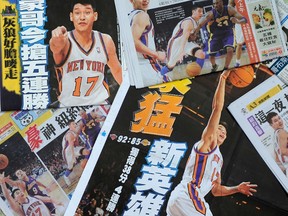 Jeremy Lin is displayed on all the local newspaper front pages in Taipei on Sunday.  The NBA legend-in-the-making  is the latest hit in Taiwan, a society craving for a true hero. (AFP PHOTO)