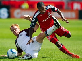 Julian de Guzman (right) has only occasionally lived up to hype surrounding his signing with Toronto FC in September 2009. His contract is up after this season. (REUTERS)