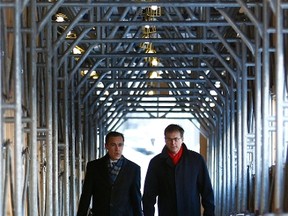 Bank of Canada Governor Mark Carney (L) walks to a news conference with Senior Deputy Governor Tiff Macklem in Ottawa January 18, 2012. (REUTERS/Chris Wattie)