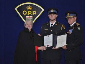 Orillia OPP Const. Elliott Duhamel accepts a St. John Ambulance award for his efforts to save the life of William Hart, who stopped breathing while in police custody July 1, 2009. (QMI Agency)