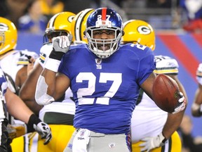 New York Giants' Brandon Jacobs celebrates scoring a touchdown against the Green Bay Packers in the second quarter during their NFL football game in East Rutherford, New Jersey, Dec. 4, 2011. (REUTERS/Ray Stubblebine)
