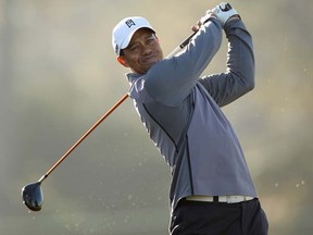 Tiger Woods hits a tee shot during a practice round for the AT&T Pebble Beach National Pro-Am on Wednesday, Feb. 8, 2012. (Ezra Shaw/Getty Images/AFP)