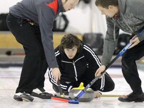 Jason Gunnlaugson (centre) has played with a few different teams this season and is now skip the Bohn Brothers at the Safeway Championship in Dauphin. (JASON HALSTEAD/Winnipeg Sun files)