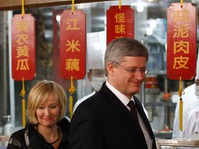 Canada's Prime Minister Stephen Harper and his wife Laureen tour a restaurant before sitting down for lunch in Beijing Feb. 9, 2012. (REUTERS/Chris Wattie)