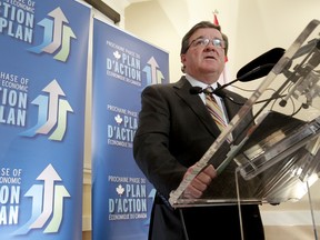 Federal finance minister Jim Flaherty speaks with media at the Calgary Chamber of Commerce in downtown Calgary on Wednesday, Jan. 11, 2012.(LYLE ASPINALL/QMI AGENCY)