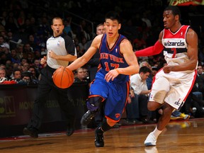 Jeremy Lin of the New York Knicks drives against John Wall of the Washington Wizards during the game at the Verizon Center on February 8, 2012 in Washington. (Ned Dishman/NBAE via Getty Images/AFP)