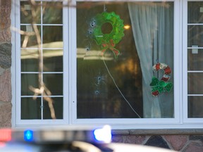 Front window of a home on Tullamore Rd., in the Kennedy Rd.-Steeles Ave. area of Brampton, is peppered with eight bullet holes following a drive by shooting around 1 a.m. Thursday. No one was injured and Peel Regional Police won’t divulge any ideas as to why the house was targeted. (ROB LAMBERTI/Toronto Sun)