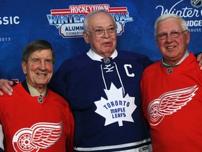 NHL alumni Ted Lindsay (left), George Armstrong and Alex Delvecchio mug for the cameras during Thursday's news conference announcing next year's Leafs-Red Wings outdoor alumni game will be played at the Detroit Tigers Comerica Park. (REUTERS)