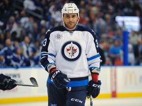 Defenceman Dustin Byfuglien (above) and forwards Alexander Burmistrov and Tim Stapleton were among those a tad under the weather when they arrived in Washington. (BRIAN BLANCO/Reuters files)