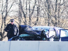 One of the vehicles involved in a double fatality collision on Highway 401 is seen here. Two vehicles were involved in the head-on collision and both drivers were pronounced dead at the scene. EMILY MOUNTNEY/QMI AGENCY