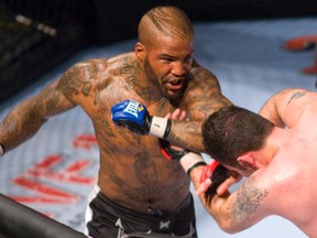 Ryan Ford, left, splits open the forehead of Karo Parysian with a elbow to the head and eventually won the match as Parysian, bleeding profusely was unable to continue Tat MMALive at the John Labatt Centre in London, Ont., on May 19, 2011.