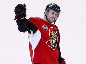 Ottawa Senators Chris Phillips acknowledges the crowd after being selected the game's first star in his 1,000th NHL game against the Nashville Predators at Scotiabank Place in Ottawa on Thursday