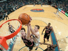 Matt Carroll #33 of the Charlotte Bobcats attempts to the block the shot of Omer Asik #3 of the Chicago Bulls during the game at the Time Warner Cable Arena on February 10, 2012 in Charlotte, North Carolina. (Getty Images)