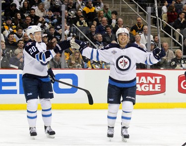 PITTSBURGH, PA - FEBRUARY 11: Alex Burmistrov #8 of the Winnipeg Jets celebrates his first period goal against the Pittsburgh Penguins during the game at Consol Energy Center on February 11, 2012 in Pittsburgh, Pennsylvania.   Justin K. Aller/Getty Images/AFP