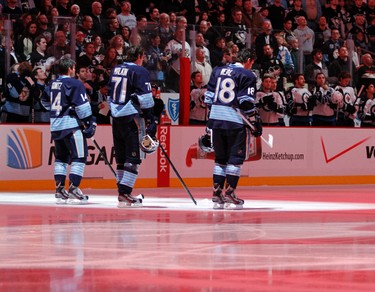 PITTSBURGH, PA - FEBRUARY 11: Chris Kunitz #14, Evgeni Malkin #71 and James Neal #18 of the Pittsburgh Penguins stand during the National Anthem before the game against the Winnipeg Jets at Consol Energy Center on February 11, 2012 in Pittsburgh, Pennsylvania.   Justin K. Aller/Getty Images/AFP