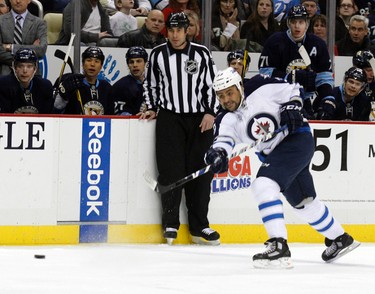 PITTSBURGH, PA - FEBRUARY 11: Dustin Byfuglien #33 of the Winnipeg Jets takes a shot against the Pittsburgh Penguins during the game at Consol Energy Center on February 11, 2012 in Pittsburgh, Pennsylvania.   Justin K. Aller/Getty Images/AFP