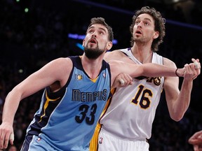 Lakers forward Pau Gasol (right) fights for a rebound with his brother, Grizzlies’ Marc Gasol earlier this season