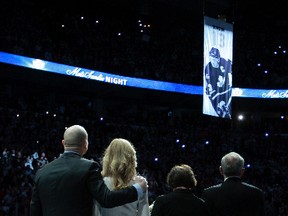 Mats Sundin (left), with his wife Josephine and parents Gunilla and Tommy, watches as his banner is raised Saturday night.