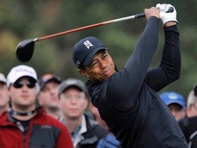 Tiger Woods tees off on the 13th hole at the Pebble Beach Golf Links during the third round of the Pebble Beach National Pro-Am in Pebble Beach, California, February 11, 2012. (REUTERS/Robert Galbraith)