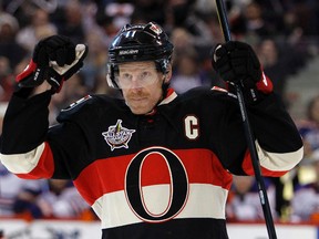 \Ottawa Senators' Daniel Alfredsson (11), right, celebrates his goal on  Edmonton Oilers' goalie, Nikolai Khabibulin, during the first period of NHL hockey action at Scotiabank Place in Kanata Saturday, February 11, 2012.  (DARREN BROWN/QMI AGENCY)