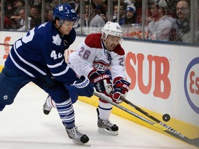 Leafs’ Tyler Bozak battles Josh Gorges of the Montreal Canadiens for the puck at the Air Canada Centre on Saturday night. (Dave Abel, Toronto Sun)