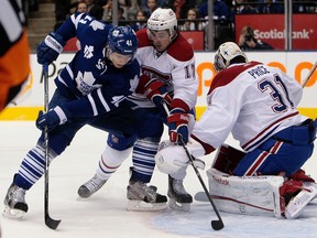 The Leafs’ Nikolai Kulemin goes for a rebound in front of Chris Campoli and Carey Price of the Montreal Canadiens on Saturday night. (Dave Abel, Toronto Sun)