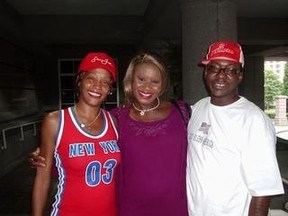 Kemi Omololu-Olunloyo, editor of HipHossip.com, with Whitney Houston and Bobby Brown in 2005. (HIPHOSSIP.COM)