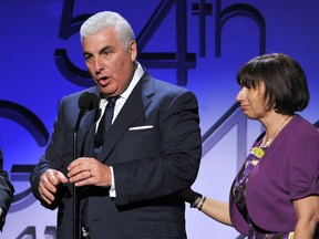 Parents of the late Amy Winehouse Mitch and Janis Winehouse along with Tony Bennett accept the award for Best Pop Duo/Group Performance for "Body and Soul" onstage at the 54th Annual Grammy Awards held at the Staples Centre on February 12, 2012 in Los Angeles, California.  (Kevin Winter/Getty Images/AFP)