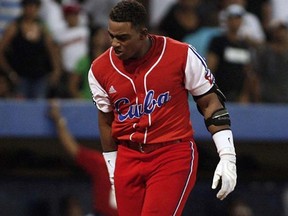 Cuba's Yoenis Cespedes has signed a contract with the A's, pending a physical. (REUTERS/Ana Martinez/Files)