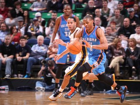 Russell Westbrook of the Oklahoma City Thunder steals the ball from Devin Harris of the Utah Jazz during last week's game in Salt Lake City. (GETTY IMAGES)