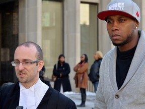 Lawyer Jeff Hershberg, left, and his client Leroy Smickle stand outside the University Ave. courthouse in Toronto on Monday after Superior Court Justice Anne Molloy ruled sentencing Smickle to the mandatory minimum of three years for a gun offence would constitute "cruel and unusual punishment." (ALEX CONSIGLIO/Toronto Sun)