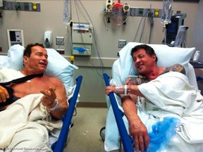 Arnold Schwarzenegger and fellow actor Sylvester Stallone, right, are shown next to each other in a Los Angeles hospital February 7, 2012, in this photograph released to Reuters February 9. Schwarzenegger was having work done on his shoulder and Stallone was having shoulder surgery. The actors will begin shooting the film "The Tomb" as their next project. (REUTERS/Copyright 2012 Arnold Schwarzenegger/Whosay.com/Handout)