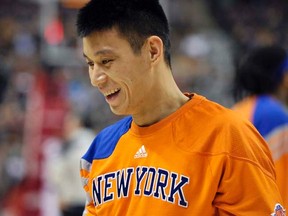 Knicks guard Jeremy Lin smiles during warm-ups before a game against the Raptors in Toronto on Feb. 14, 2012. (REUTERS/Mike Cassese)
