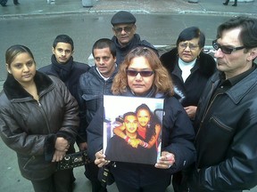 The family of Brampton victim Keith Ramdahin, 25, (mom Amanda holds a picture of him and daughter Camille - her only children) outside Brampton court on Wednesdayafter Annaz Ahmad pleaded guilty to dangerous driving causing death. (IAN ROBERTSON/Toronto Sun)