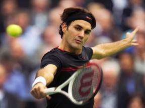 Roger Federer plays a shot against Nicolas Mahut during the World Indoor Tournament in Rotterdam, Netherlands, Feb. 15, 2012. (PAUL VREEKER/Reuters/United Photos)