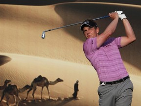 World No. 1 Luke Donald of England watches his shot from the 15th tee during the first round of the recent Abu Dhabi Golf Championship. (REUTERS)