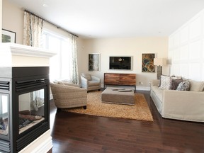 An upgraded three-sided fireplace in between the family room and the kitchen of the Piccadilly is a defining element.