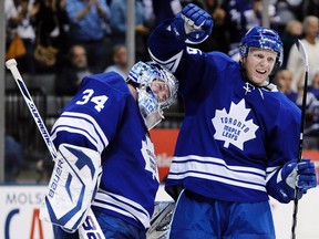 Maple Leafs defenceman Carl Gunnarsson (right) might be able to tap the mask of his goaltender in a post-game situation as early as Tuesday when the Leafs face New Jersey. (Mark Blinch/Reuters files)