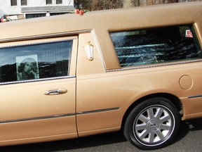 The casket of the late singer Whitney Houston as seen through the hearse window as it arrives for her burial service at the Fairview Cemetery on February 19, 2012 in Westfield, N.J. John W. Ferguson/AFP
