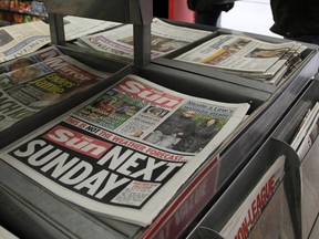 Copies of The Sun newspaper are seen for sale at a newsstand in London February 20, 2012. News International, the British newspaper arm of Rupert Murdoch's News Corp group, announced on Sunday it would publish a Sunday edition of Britain's scandal-hit Sun tabloid for the first time next weekend.
REUTERS/Stefan Wermuth