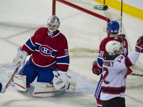 The Devils Matt Taormina scores against the Canadiens in Montreal, Feb. 19, 2012. (PIERRE-PAUL POULIN/QMI Agency)